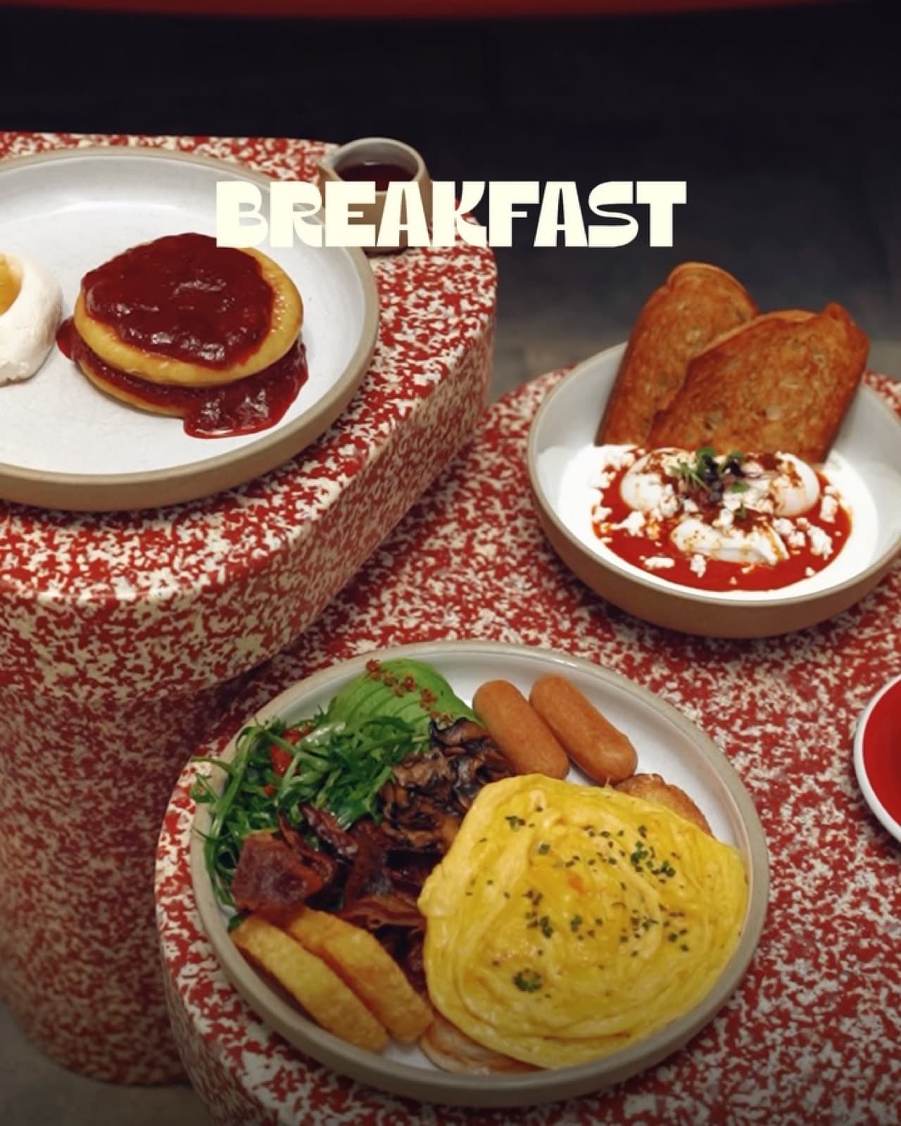 Breakfast spread on the red terrazzo tables